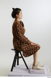 Aera  1 brown dots dress casual dressed sitting white…